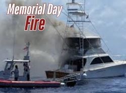 Boat with smoke coming off it from a fire